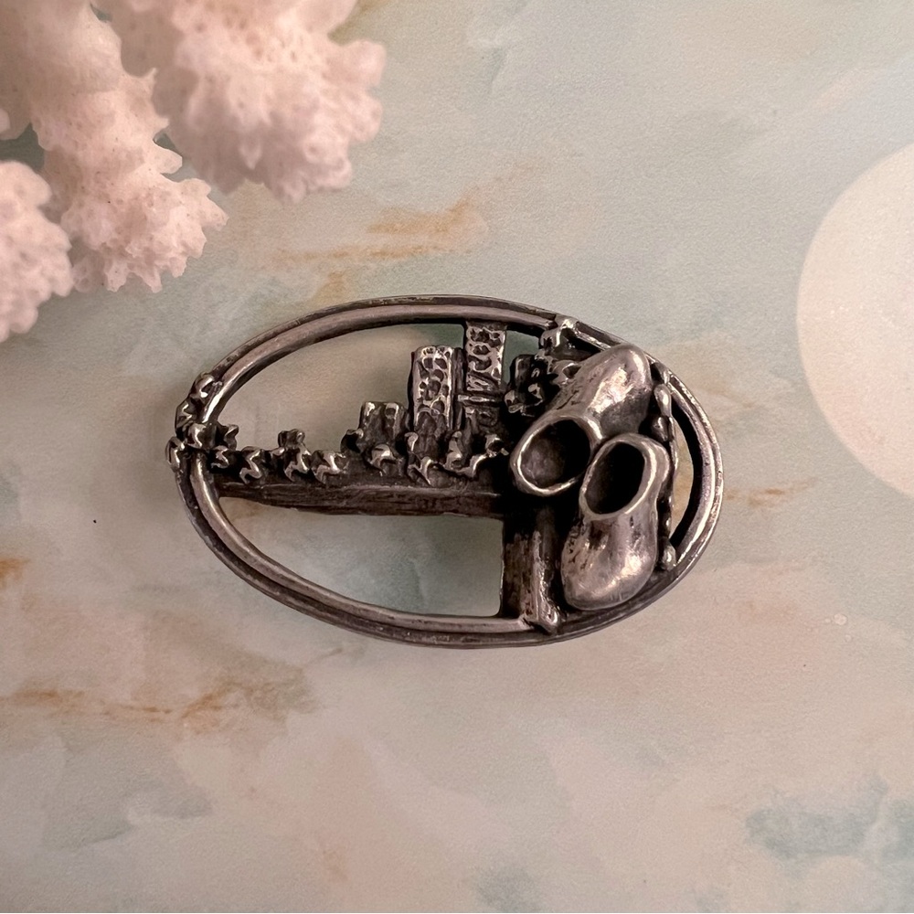 Oval Silver Tone Brooch with Clogs